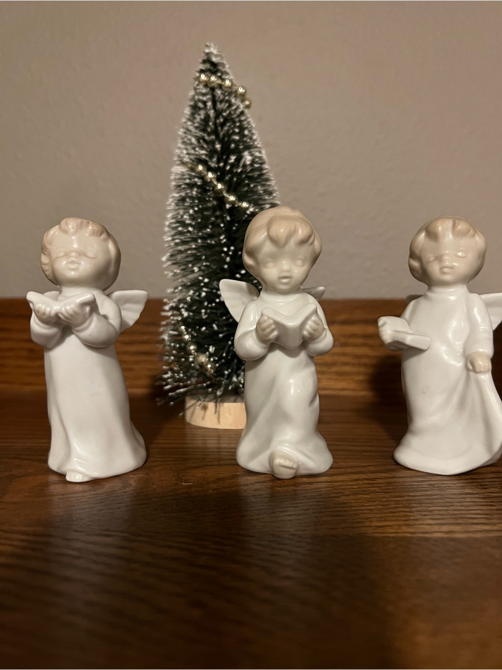 Set of Three White Ceramic Singing Angel Figurines